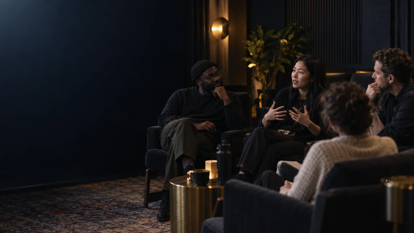 Colleagues reflecting together after a documentary screening in a small meeting room
